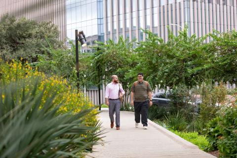 advisor and student walking