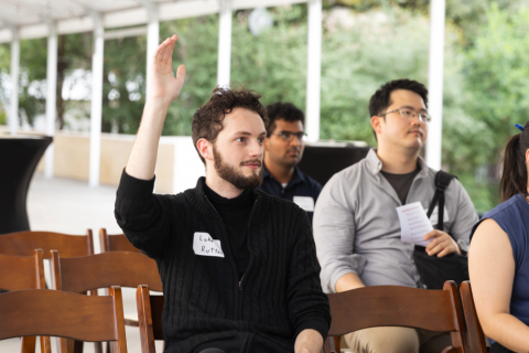 student raising hand